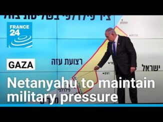 Netanyahu pointing at map during presentation.