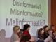 Children presenting on misinformation in Finland.
