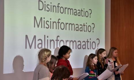 Children presenting on misinformation in Finland.