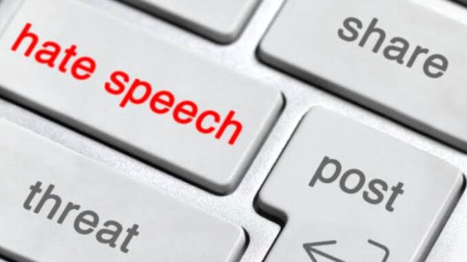Keyboard keys labeled hate speech, share, threat.