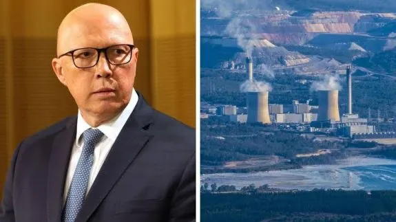 Man in suit beside industrial power plant. Man in suit beside industrial power plant.