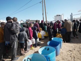 People in line for water distribution.