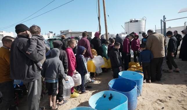 People in line for water distribution.