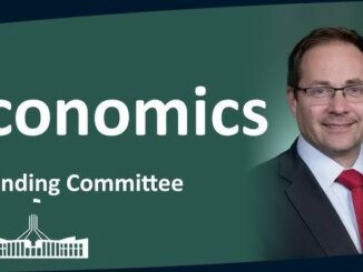 Economics Standing Committee with smiling man.