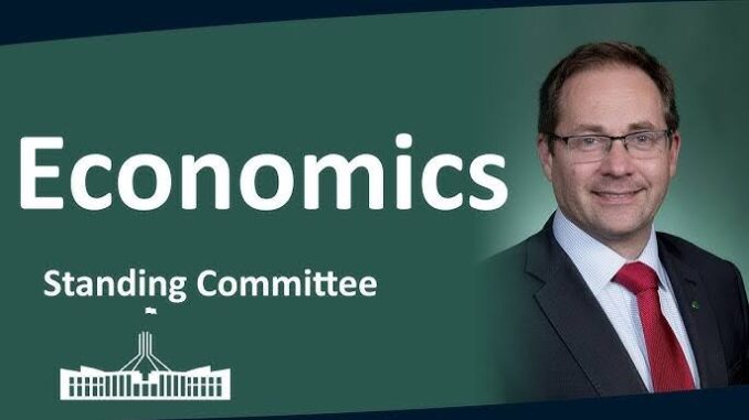 Economics Standing Committee with smiling man. Economics Standing Committee with smiling man.