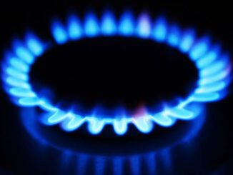 Blue flame on a gas stove burner.