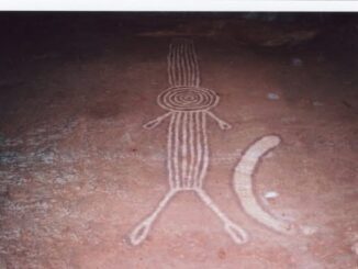 Ancient rock engraving of human figure.