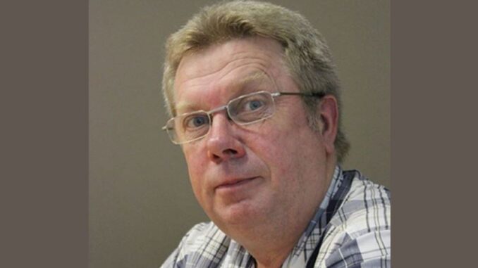Man with glasses wearing plaid shirt. Man with glasses wearing plaid shirt.