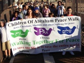 People holding banner during peace walk.