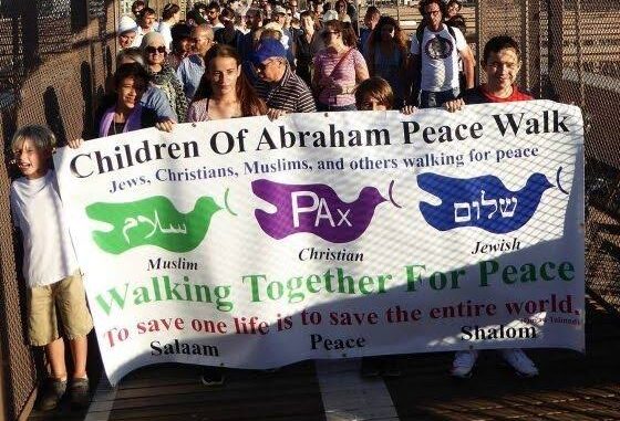 People holding banner during peace walk.