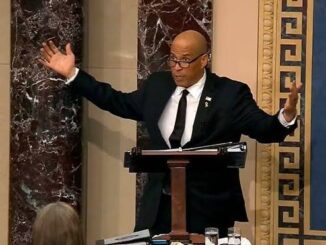 Person speaking passionately at a podium.