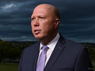 Man in suit under cloudy sky background.