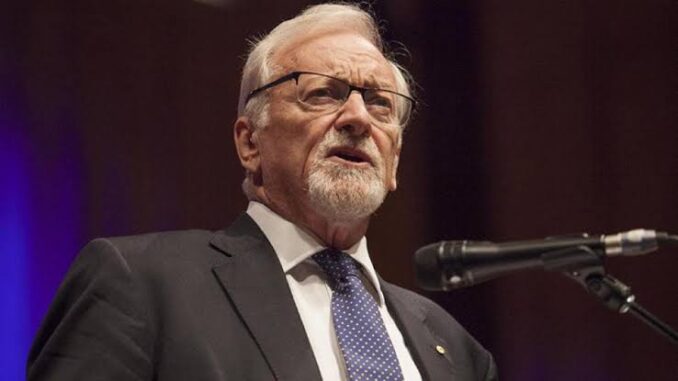Bearded speaker wearing glasses and patterned tie Bearded speaker wearing glasses and patterned tie