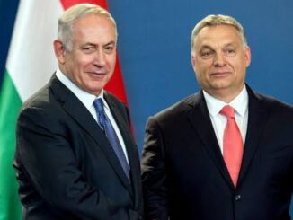 Two men shaking hands, flags in background.