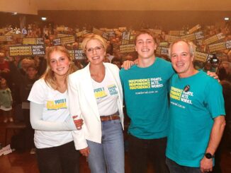 Group at event with campaign signs.