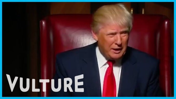 Man in suit sitting on red chair. Man in suit sitting on red chair.