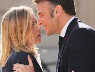 Two people greeting each other closely.