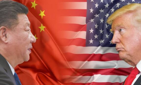 Two leaders with Chinese and American flags.