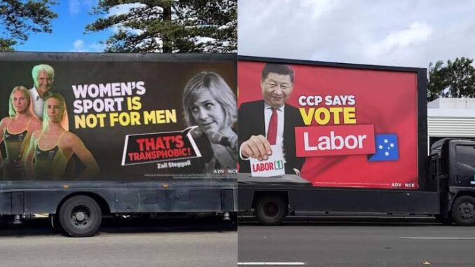 Two trucks with political advertisement banners. Two trucks with political advertisement banners.