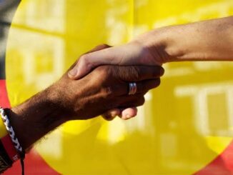 Two people shaking hands in front of a yellow background.