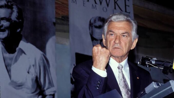 Man in suit making a rude hand gesture. Man in suit making a rude hand gesture.