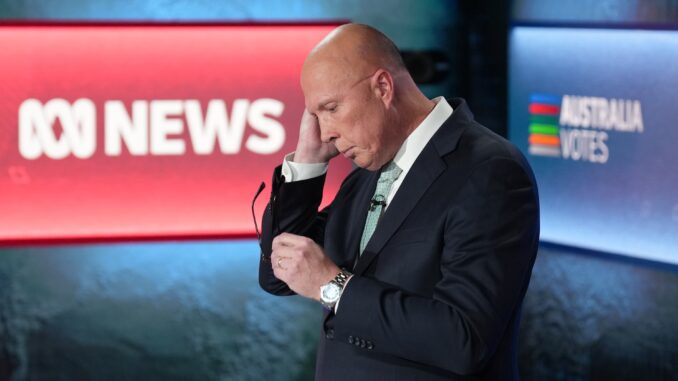 Man adjusting earpiece during news broadcast. Man adjusting earpiece during news broadcast.