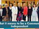 Group of professional women standing together in a conference room.