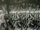 Soldiers marching in formation during a historical military parade.