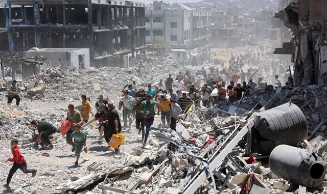 People navigate through rubble after a devastating earthquake. People navigate through rubble after a devastating earthquake.