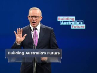 A man speaking at a podium with "Building Australia's Future" signs.
