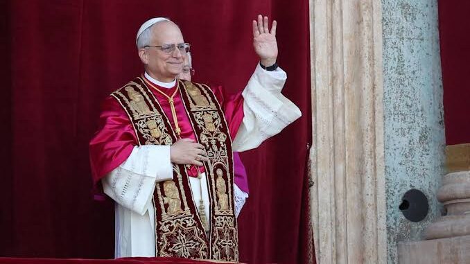 A pope in ornate robes waving from a balcony. A pope in ornate robes waving from a balcony.