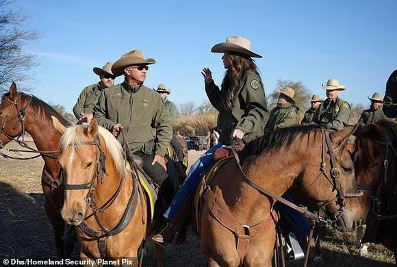 Cowboys and cowgirls talking while riding horses in a desert.