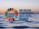 Logo for UN Ocean Conference Nice 2025, France, with ocean waves and colorful circle.