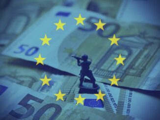 A toy soldier standing on Euro banknotes with EU stars.