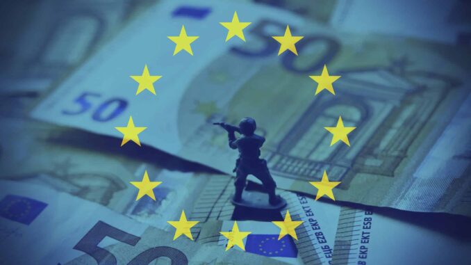 A toy soldier standing on Euro banknotes with EU stars. A toy soldier standing on Euro banknotes with EU stars.