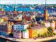 A vibrant aerial view of a European city with colorful buildings and waterfront.