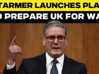 A man in a suit speaks passionately at a podium with bold text about preparing the UK for a crisis.