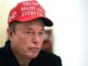 A man wearing a red 'Trump Right About Everything' hat.