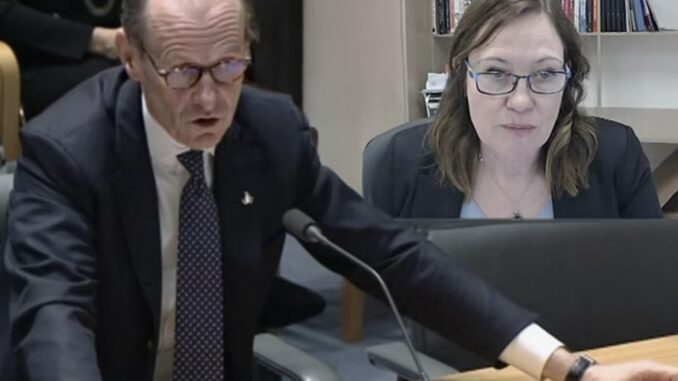 Two professionals engaged in a serious discussion at a meeting. Two professionals engaged in a serious discussion at a meeting.