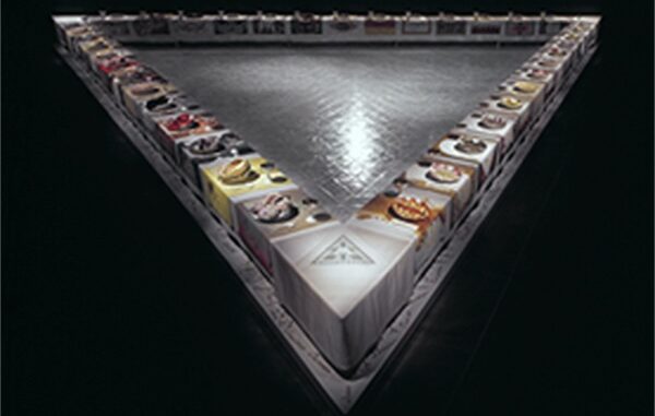A triangular display of colorful spices in bowls. A triangular display of colorful spices in bowls.
