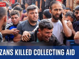 A group mourns over a man killed while collecting aid.