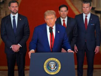 Former President Trump speaks at a podium with the presidential seal, flanked by suited men.