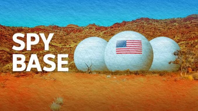 Two golf balls with an American flag on a desert landscape. Two golf balls with an American flag on a desert landscape.
