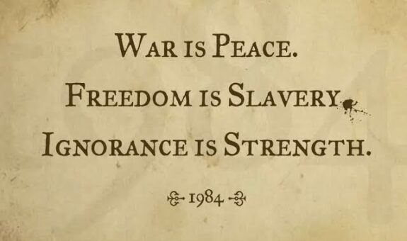 A parchment with a contrasting slogan about war, freedom, and ignorance.