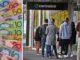 People queue outside a Centrelink office with colorful Australian banknotes nearby.