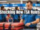 TSA officer inspecting a traveler's suitcase at the airport security checkpoint.