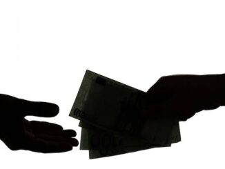 Silhouettes of hands exchanging money against a white background.