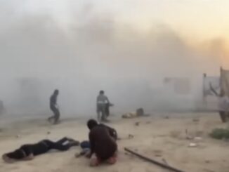 People amidst heavy smoke and debris in a chaotic scene.