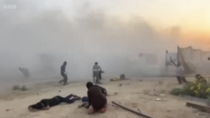 People amidst heavy smoke and debris in a chaotic scene. People amidst heavy smoke and debris in a chaotic scene.