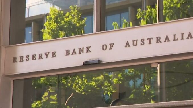Entrance sign of the Reserve Bank of Australia on a sunny day.
